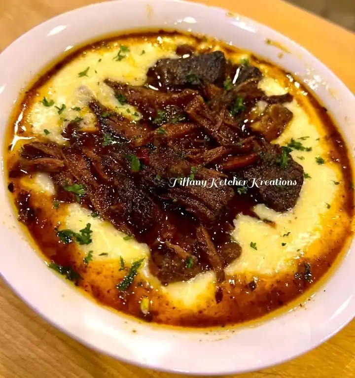 Delicious Beef Burgundy served on top of creamy Smoked Gouda grits