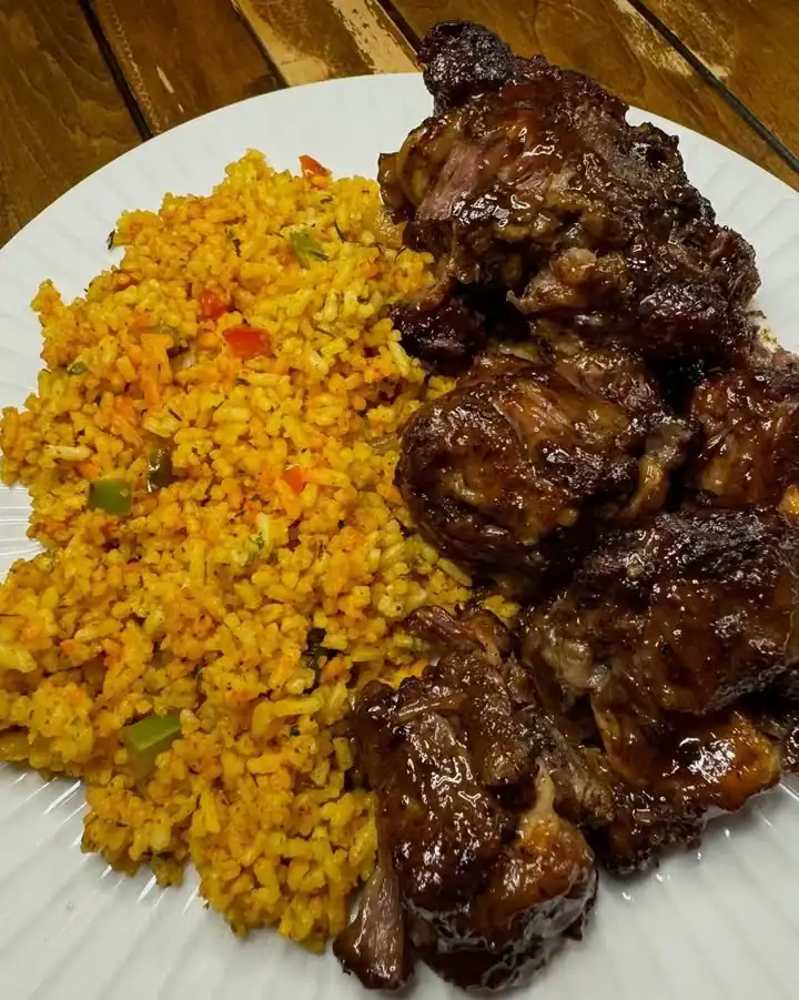 Delicious jerk oxtails served with rice for a flavorful Caribbean meal