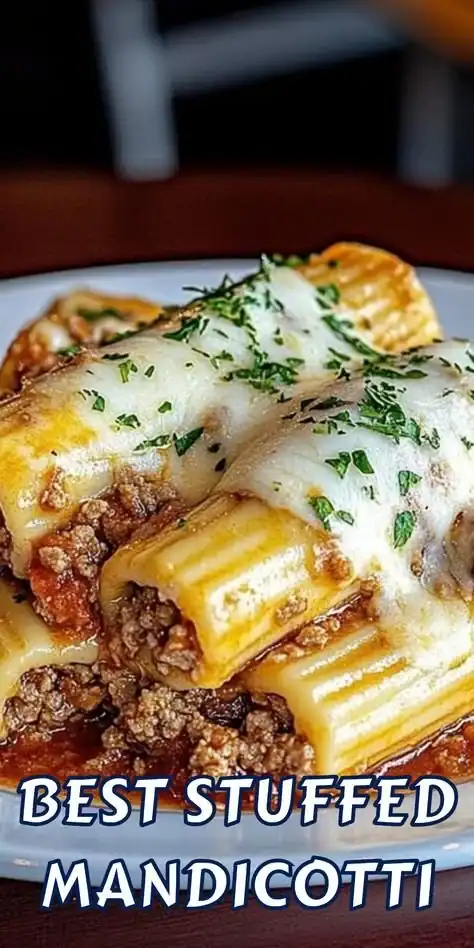 Stuffed manicotti filled with cheese and meat sauce served on a plate