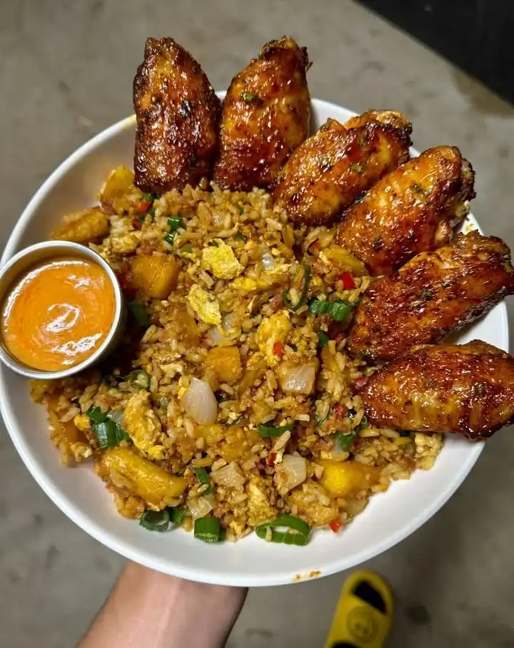 Wings and bacon jalapeño pineapple fried rice topped with spicy Yum Yum sauce.