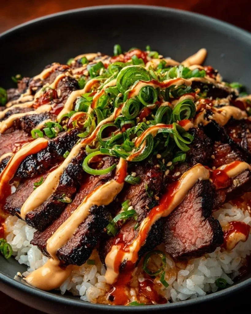 Korean BBQ steak rice bowl with spicy cream sauce and fresh vegetables