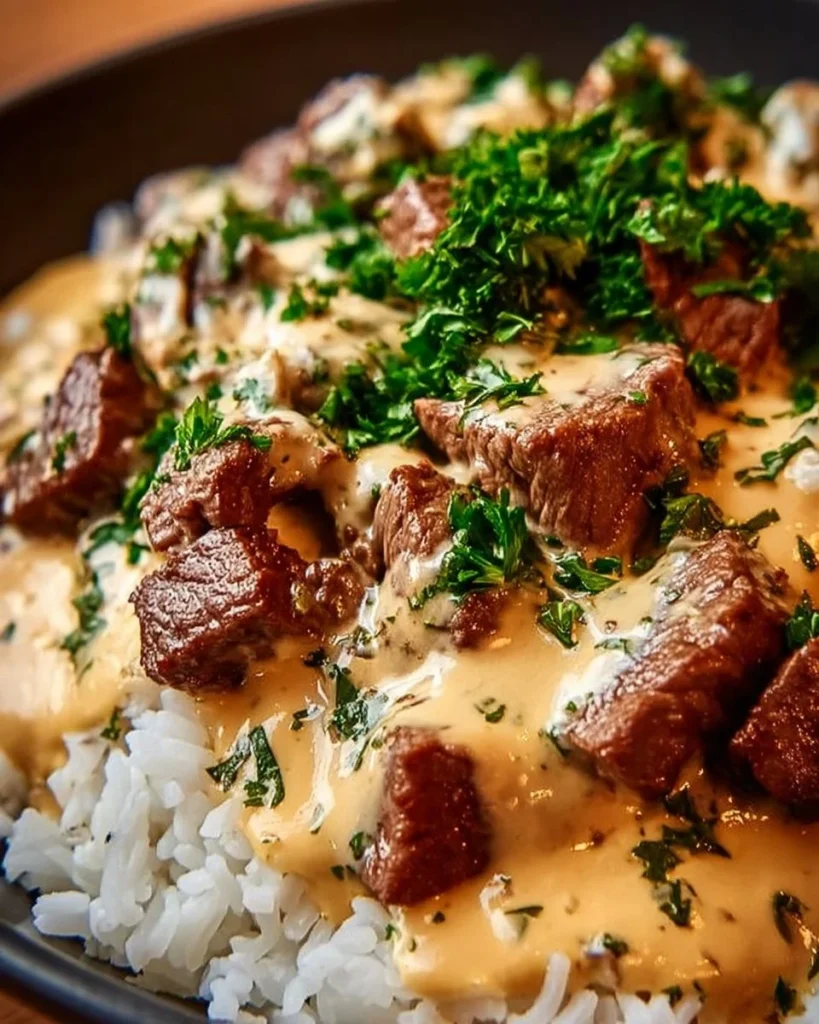 Steak Queso Rice Bowl with tender steak, cheesy queso, and fresh ingredients